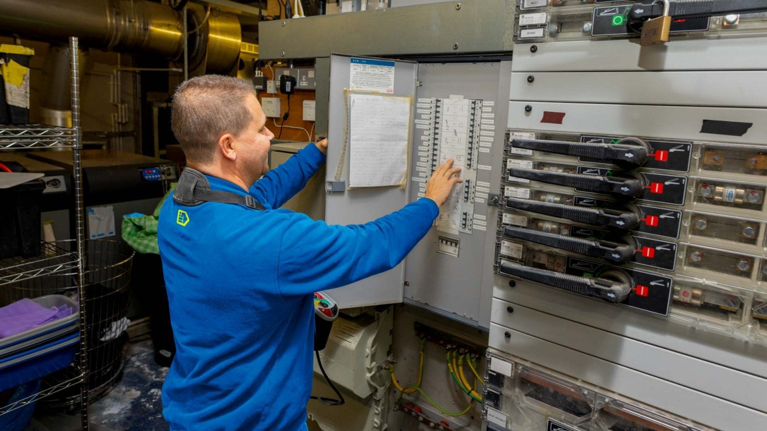 Electrician doing a commercial EICR at a school