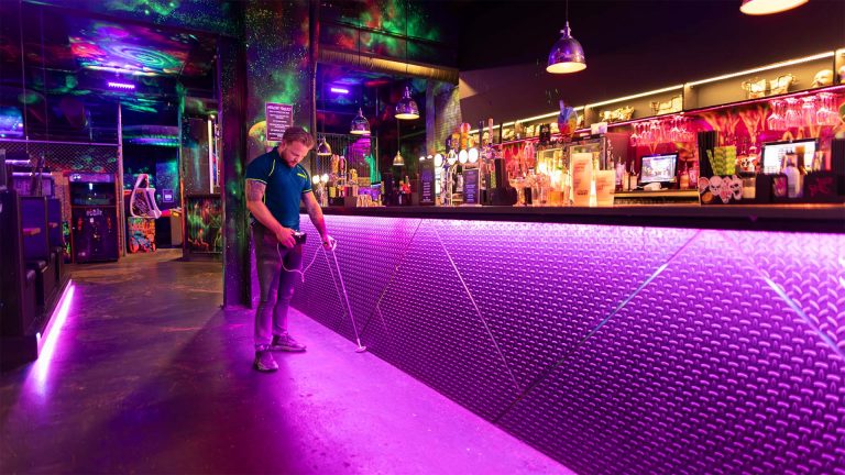 An Aspect leak detection specialist traces a concealed like in a nightclub.