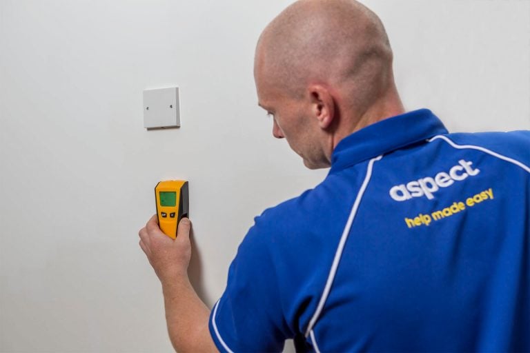 Handyman checks before hanging or mounting