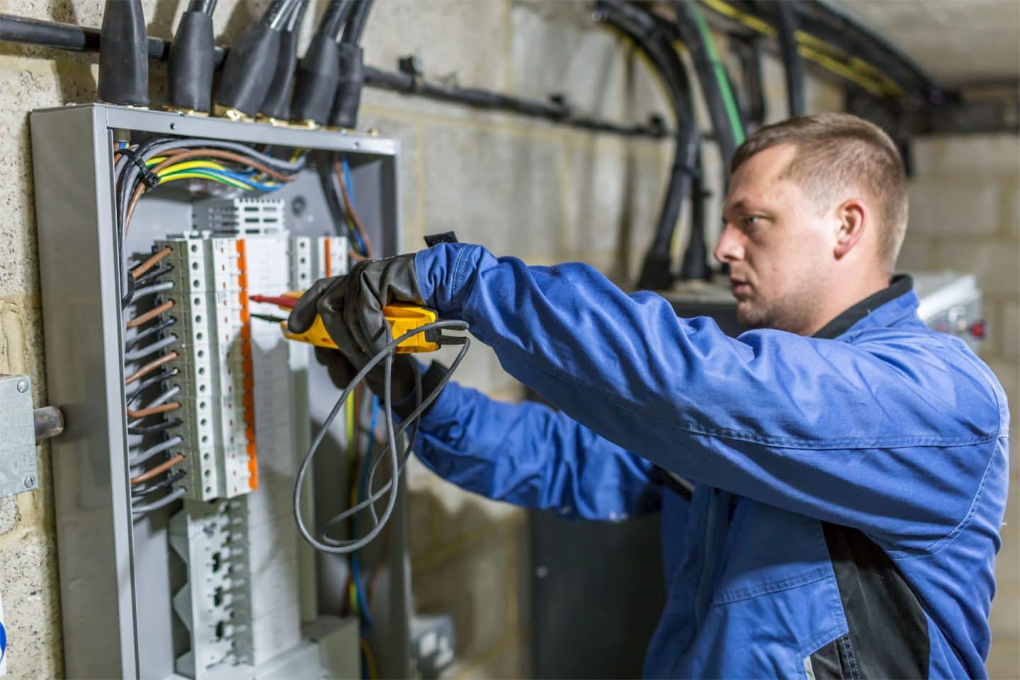 An Aspect electrician testing circuits on a commercial consumer unit as part of an EICR